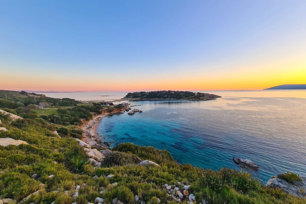 Turquoise Aegean bay at sunset outside the high season